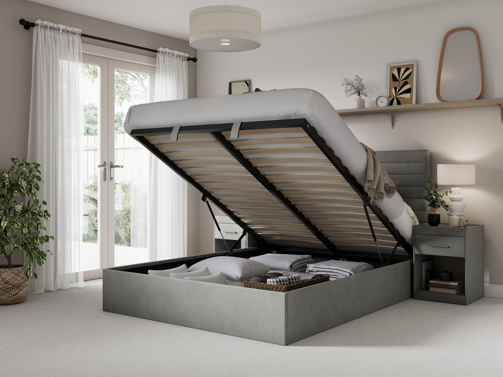 Blue ottoman bed showing ottotman storage in a bedroom
