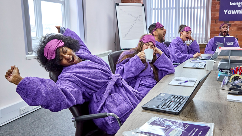 Yawning and stretching in the boardroom at the Bensons for Beds Headquarters.