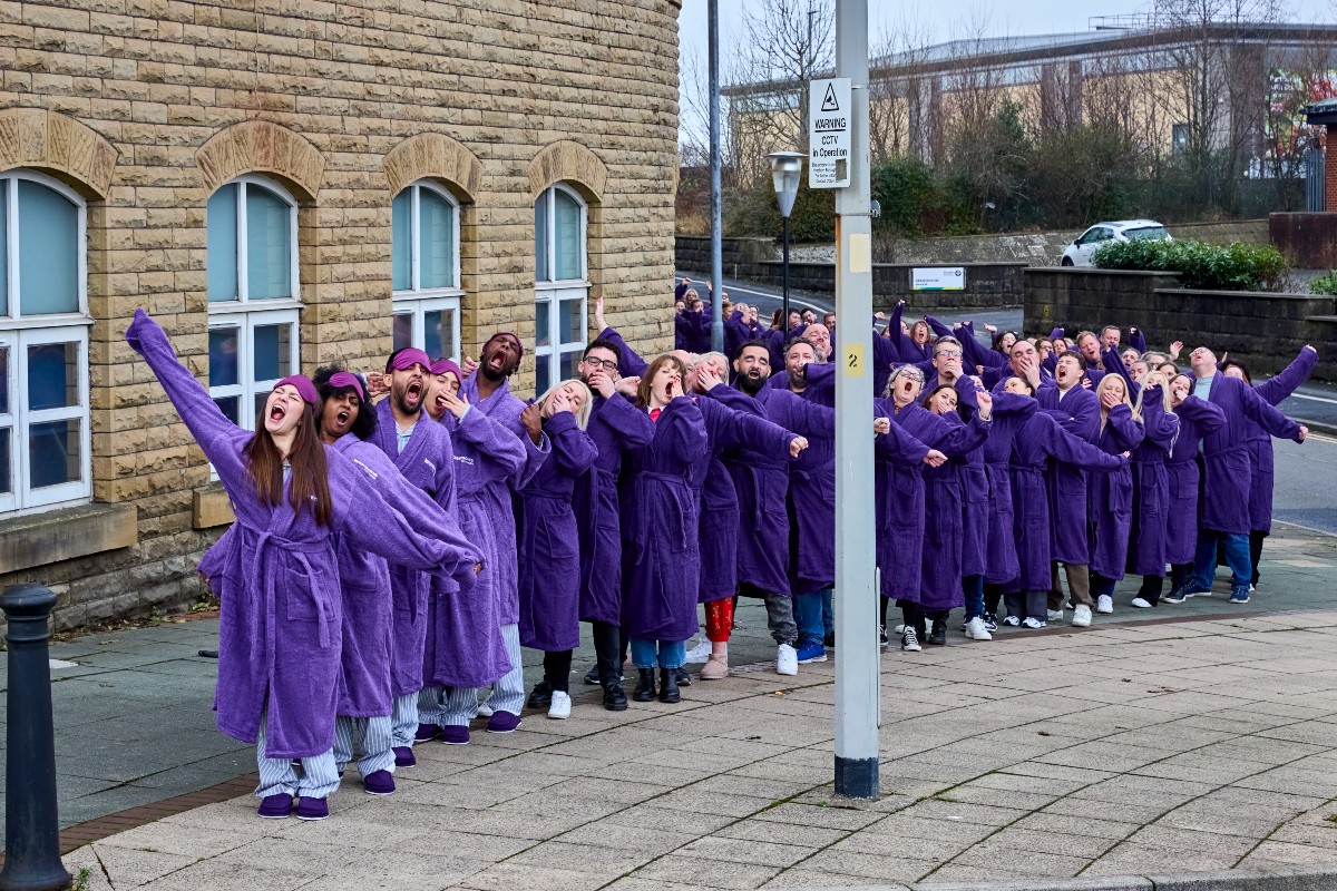 A line of people caught up in a highly contagious yawn.