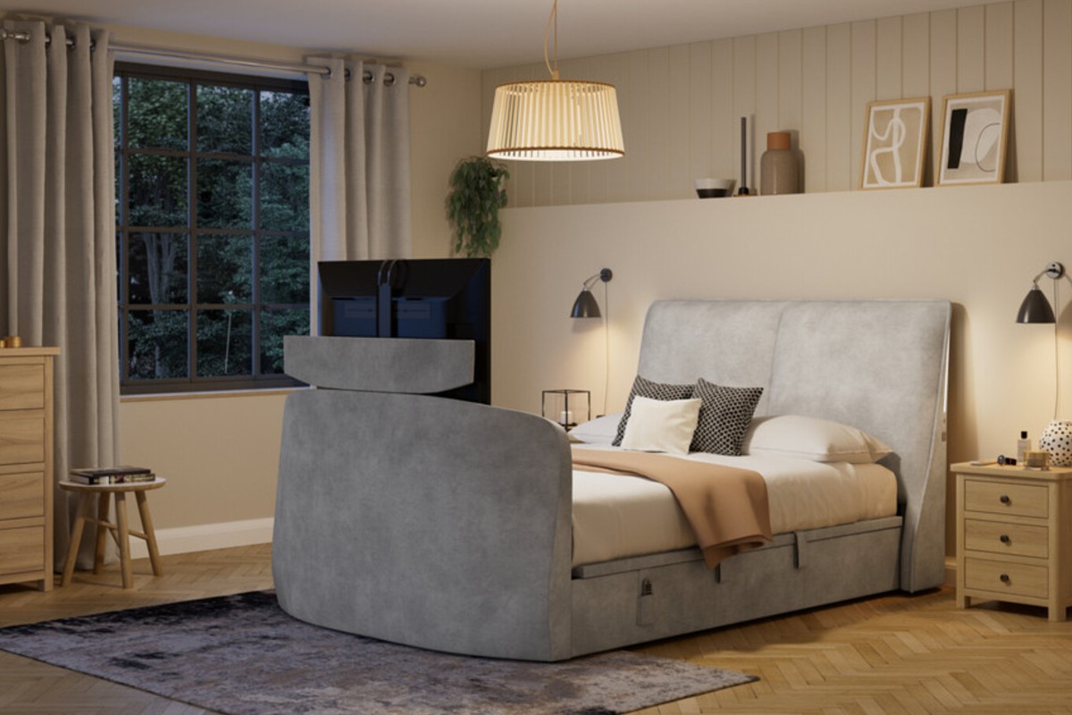 A TV bed with a padded headboard and built-in storage in a modern bedroom.