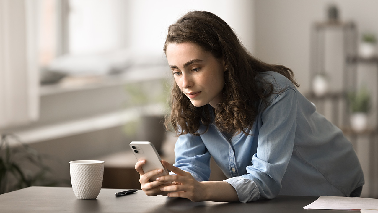 A girl on her phone in bed