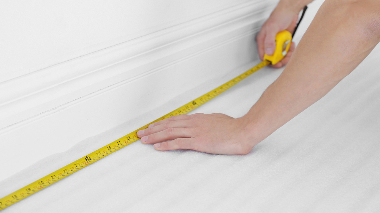 a person using a measuring tape