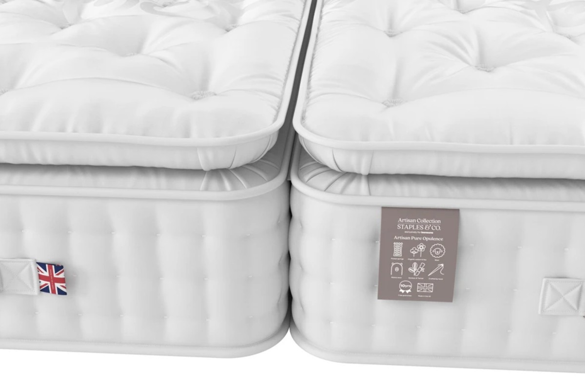 Two plush mattresses with tufted, quilted tops, highlighting their thick padding.