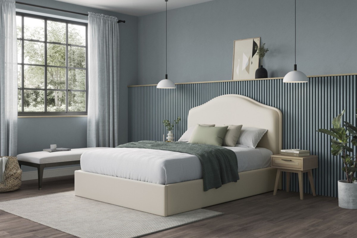 A cream ottoman bed discreetly hiding bedroom clutter.