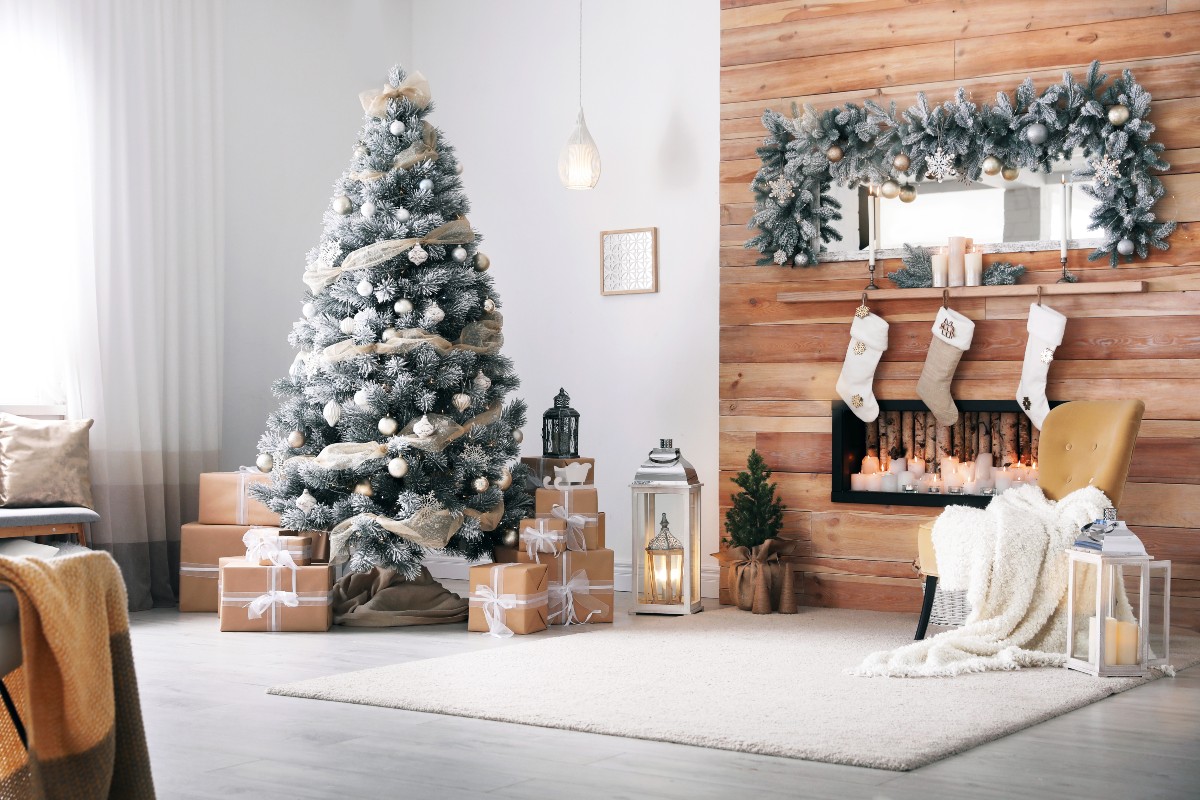 A beautifully minimalist Christmas home complete with cosy throws on the sofas and stocking hung on the fireplace