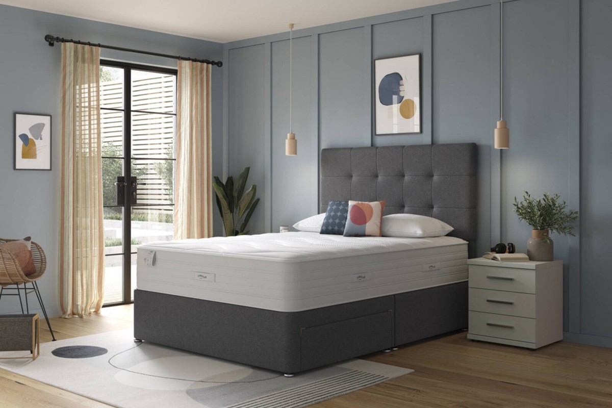 A duck egg blue bedroom design with a charcoal grey divan bed set as a centrepiece.