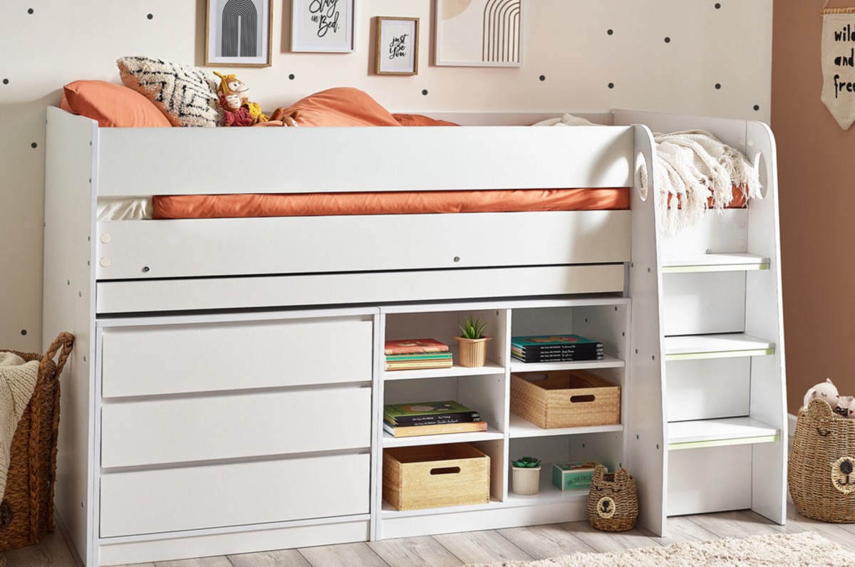 The Felix white wooden cabin bed with desk displayed in a child's bedroom