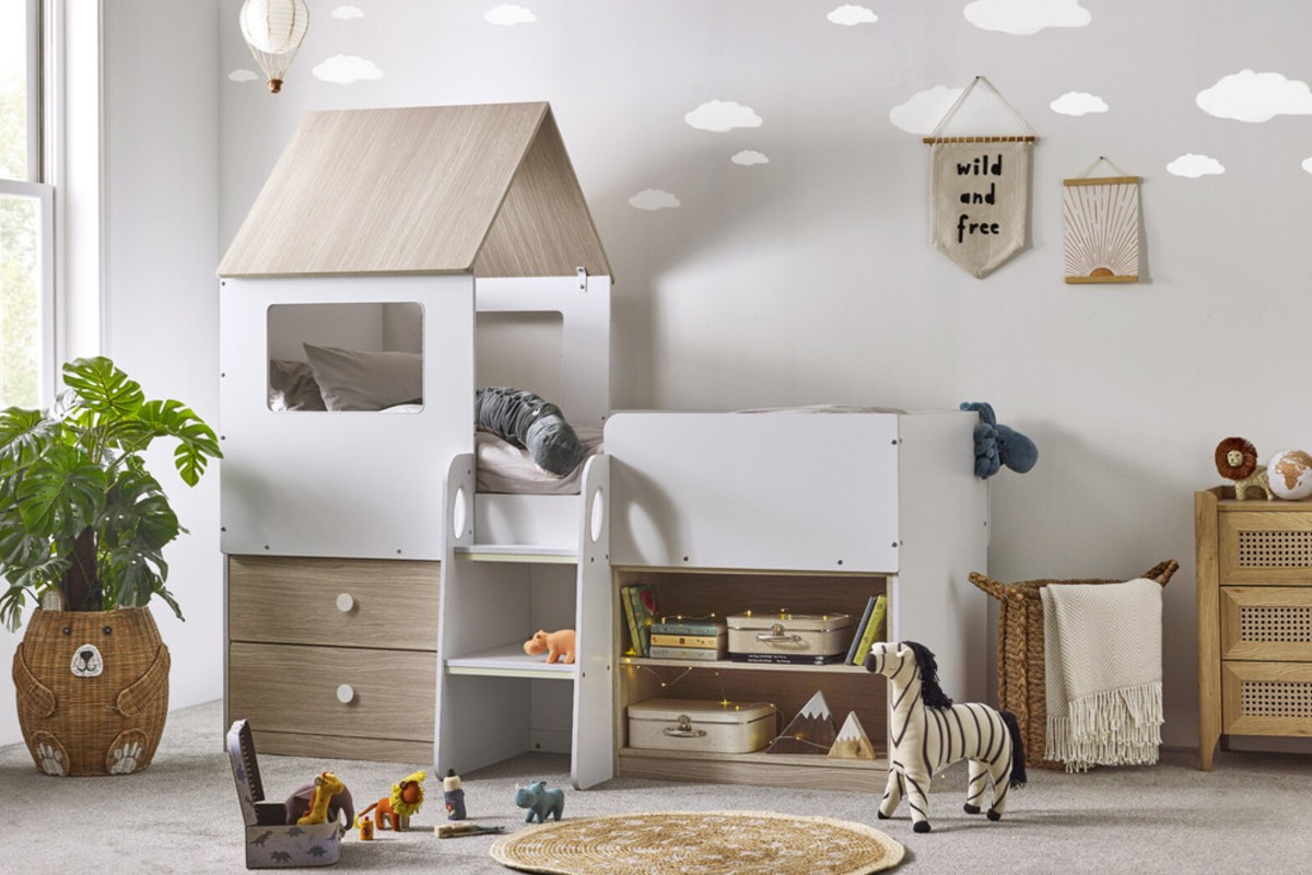 A cosy kids’ room with a white Midsleeper bed and toys arranged around it.