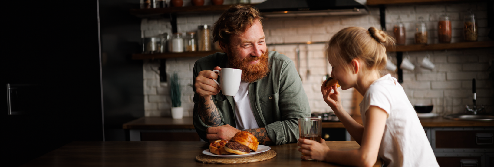 man with a beard enjoying a coffee